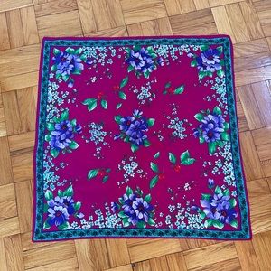 Vibrantly colored deep wine-colored flowered scarf.